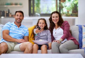 Cropped shot of a family watching a movie on the sofahttp://195.154.178.81/DATA/i_collage/pi/shoots/806224.jpg